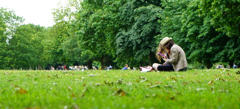 People sitting on grass in a park