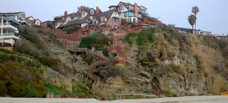 luxurious properties on a hill next to the beach