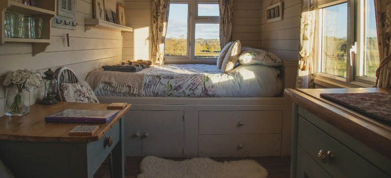 a bed with built-in drawers for storage