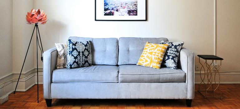 grey sofa with colorful pillows