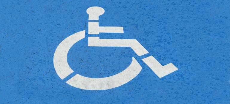 a blue sign indicating that it's an area for the disabled person to use