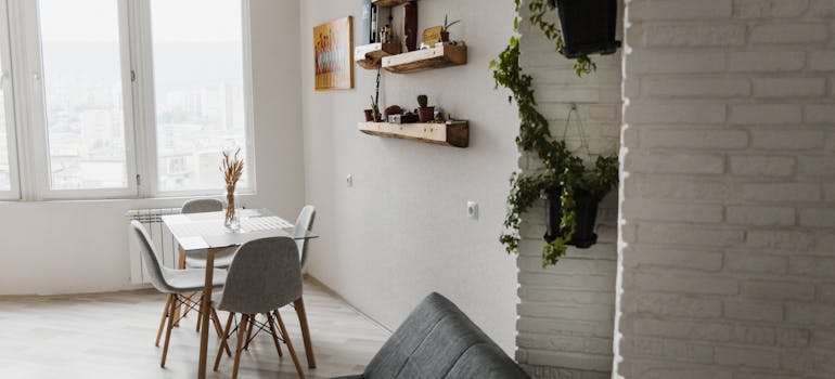 a room with wall-mounted shelves which is one of the storage ideas for small apartments