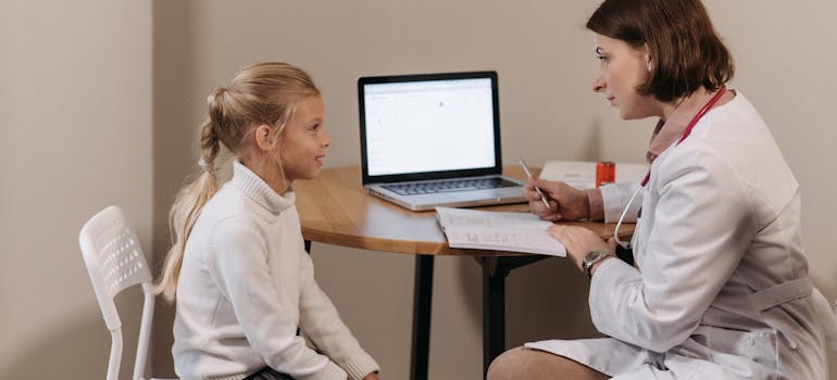 a child being examined by a doctor