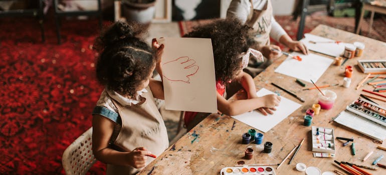 several kids participating in a drawing workshop