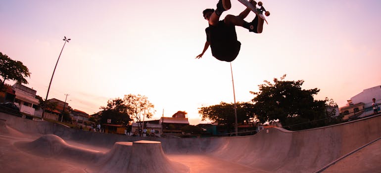 a skater in the air at a skate park