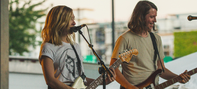 a two-member band performing on a stage