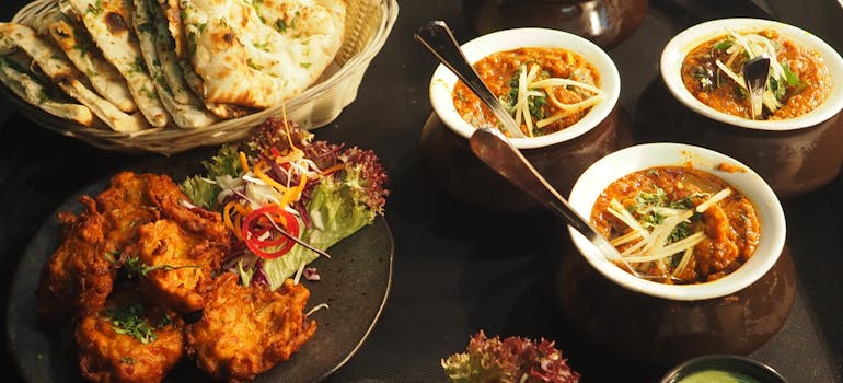 many different dishes on a table in a restaurant