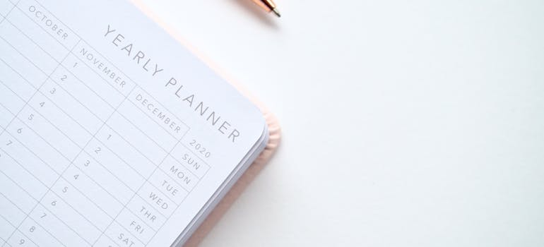 a planner and a pen next to it