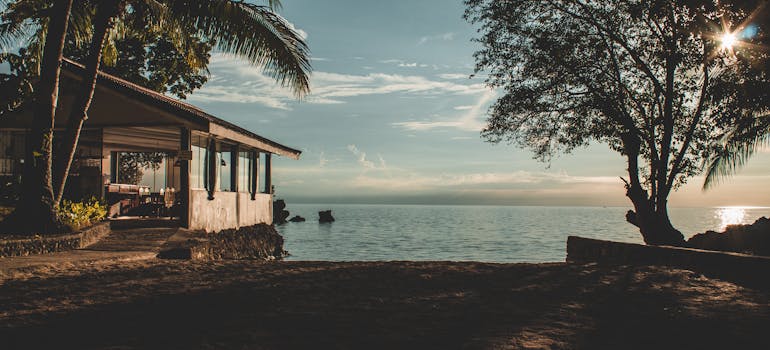 a beach house at sunset