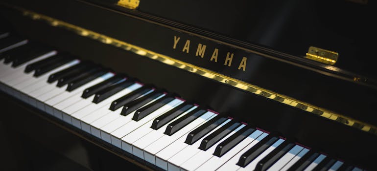 a black piano with golden elements