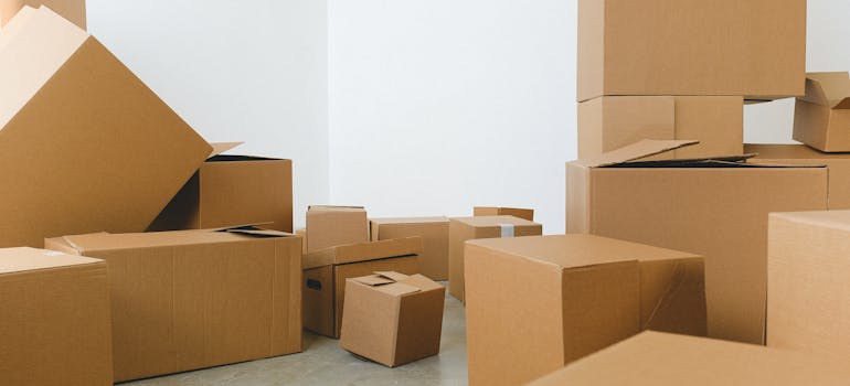 a large number of cardboard boxes indicating another reason why you should hire professionals for your office move