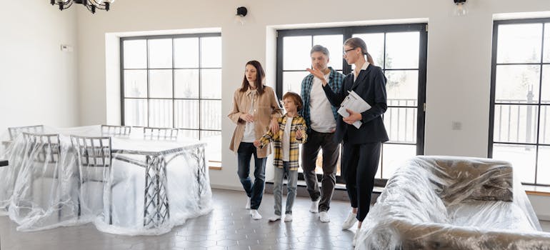 a family inspecting their new home before moving in