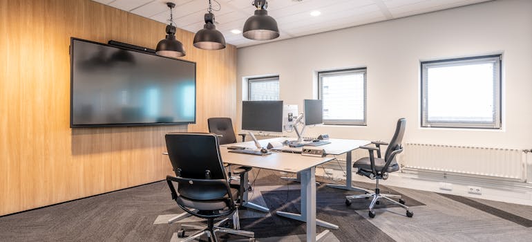 an elegant and fully set-up office with a desk in the center of it