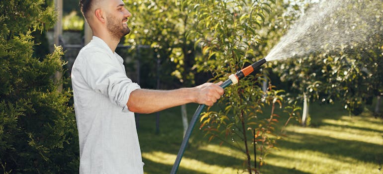 a man watering his lawn