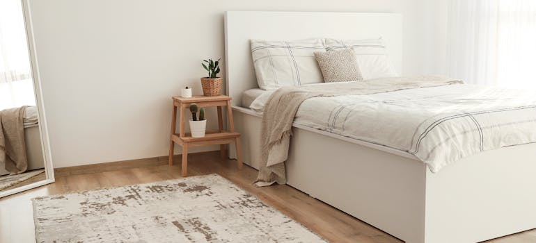 a bedroom with neutral colors as a good example of how to stage your Laguna Niguel home like a pro