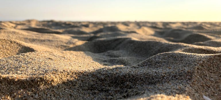 sand on the beach near the city of Orange