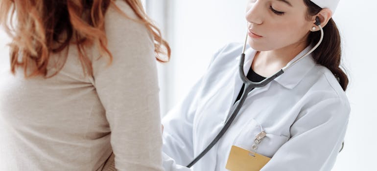 a doctor examining a patient 