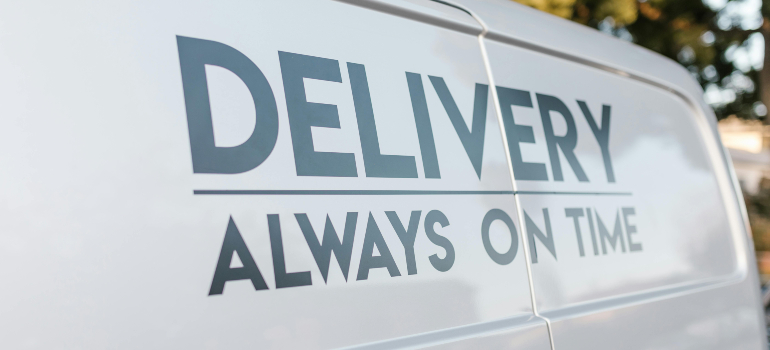 A delivery van with 'Always on Time' written on it, representing punctuality during a relocation from Long Beach to Irvine.