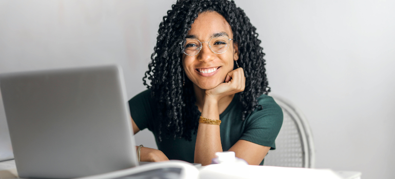 a girl researching on a laptop about remote workers moving to San Clemente