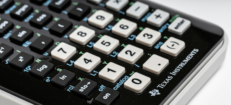 Calculator on a white surface used for finding the perfect home in Garden Grove