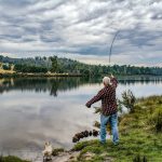 A man fishing on a lake