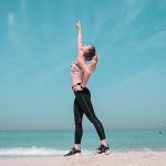 a girl doing fitness at the beach