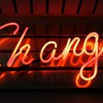 a neon sign spelling the word "change"