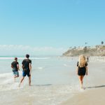 people walking along an amazing beach