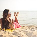 a woman sunbathing at the beach