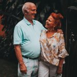 an elderly couple with smiles on their faces