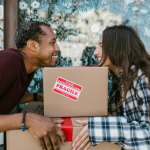 a couple happy because they are moving from Garden Grove to Laguna Beach