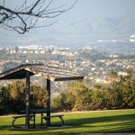 A shaded picnic table overlooking a scenic view of Aliso Viejo.